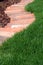 Ornamental garden bed and lawn grass path