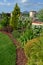 Ornamental garden with group of colourfull shrubs perennials and conifers