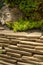 Ornamental stone masonry in the garden. Flat light brown stones