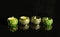 Ornamented candlesticks with reflection on soft surface and black background