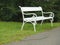 Ornamented white iron park bench