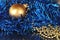 Ornaments and merry christmas metal text on gold background