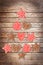 Ornaments on wood planks background creating the shape of a Christmas tree