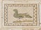 Ornate ancient roman floor tiles depicting a bird, detail of Ruins of Italica, Roman city in the province of Hispania Baetica