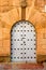 Ornate arched stone door in Poble Espanyol