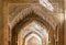 Ornate arches in a  Lions patio of Alhambra, Granada, Spain