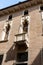 An ornate balcony on the facade of Palazzo Thiene on Contra Porti, Vicenza, Italy