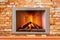 Ornate brick fireplace with a roaring fire burning in the hearth, emitting a warm and inviting glow