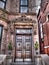 An ornate brownstone building entryway door