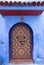 ornate color door on street in Morocco