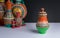 Ornate colorful pottery vase on background of blurred colorful vases