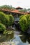 Ornate column in formal Balinese garden