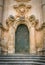 Ornate door to the Duomo of San Giorgio in Modica, fine example of sicilian baroque art. Sicily, southern Italy.