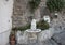 Ornate drinking fountain with small statue of a cherub holding a dolphin, Marina Grande, Sorrento