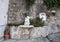 Ornate drinking fountain with small statue of a cherub holding a dolphin, Marina Grande, Sorrento