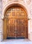 Ornate entrance with old wooden door