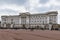 Ornate facade of the Buckingham Palace, the royal residence of the British Monarchs with tourists in front in London UK