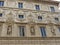 Ornate facade of statues at Palazzo Spada to Rome in Italy.