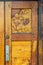 Ornate hand carved heavy old varnished wooden door with Dogwood Flower design.