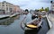 Ornate iconic gondolas parked in the canal in early evening light, Aveiro, Portugal