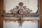 ornate ironwork detailing against rustic plaster walls