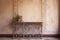 ornate ironwork detailing against rustic plaster walls