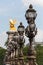 Ornate lampposts on Alexander III bridge in Paris