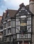 Ornate Liberty`s clock above an arch on Great Marlborough St with Saint George slaying a dragon in London United Kingdom