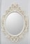 Ornate mirror on the wall. Round frame