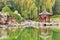 Ornate pavilion mirrored in lake, Ritan Park, Beijing, China