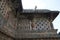 Ornate perforated window and Madanikas, Salabhanjika meaning celestial damsels, on top of the pillars. Chennakeshava temple, Belur