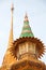 Ornate roof tops decorated with gold & colours of the Wat Trimit temple in Chinatown, Bangkok, Thailand