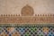 Ornate Stucco Wall and Zellij Mosaic tiles at Nasrid Palaces of Alhambra - Granada, Spain