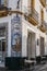 Ornate tiled sign outside Puerta de la Carne restaurant in Seville, Spain