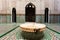 Ornate tiles and fountain in a madrasa