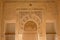 Ornate wall with horse shoe arch of Nasrid Palace , Alhambra, Spain