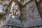 Ornate wall panel reliefs depicting Goddess Kali on the left and Govardhan Girdhari on the right, Hoysaleshwara temple, Halebidu,