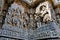 Ornate wall panel reliefs depicting Goddess Kali on the left and Vamana incarnation of Vishnu on the right, Hoysaleshwara temple,