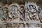 Ornate wall panel reliefs depicting from left Shiva-Parvati and dancing Sarswati, Kedareshwara temple, Halebidu, Karnataka