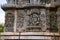 Ornate wall panel reliefs depicting From left Varaha, Kamdev and his wife Rati, and dancing Ganesha. Kedareshwara temple, Halebidu