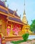 The ornate wall of Wat Phrao and golden chedi behind it, Wat Phra That Lampang Luang, Lampang, Thailand