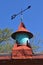 Ornate wind vane and colorful cupola