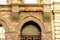 Ornate yellow brick exterior facade and window detail