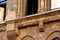 Ornate yellow brick exterior facade and window detail