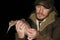 Ornithologist holding the eurasian Woodcock in hands