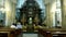 OROPA, BIELLA, ITALY - JULY 7, 2018: people sit on the benches, at the altar, in the catholic church. Shrine of Oropa