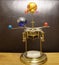 Orrery steampunk art clock with planets of the solar system.