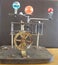 Orrery steampunk art clock with planets of the solar system.