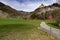 Ortenstein Castle in the Swiss Alps with a hike and bike trail in the foreground