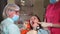 Orthodontist doctor treats a patient of a dental clinic who came for oral care